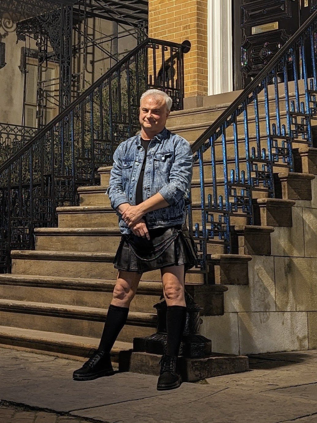 Patrick Burns Savannah ghost tour guide in kilt on historic steps at night