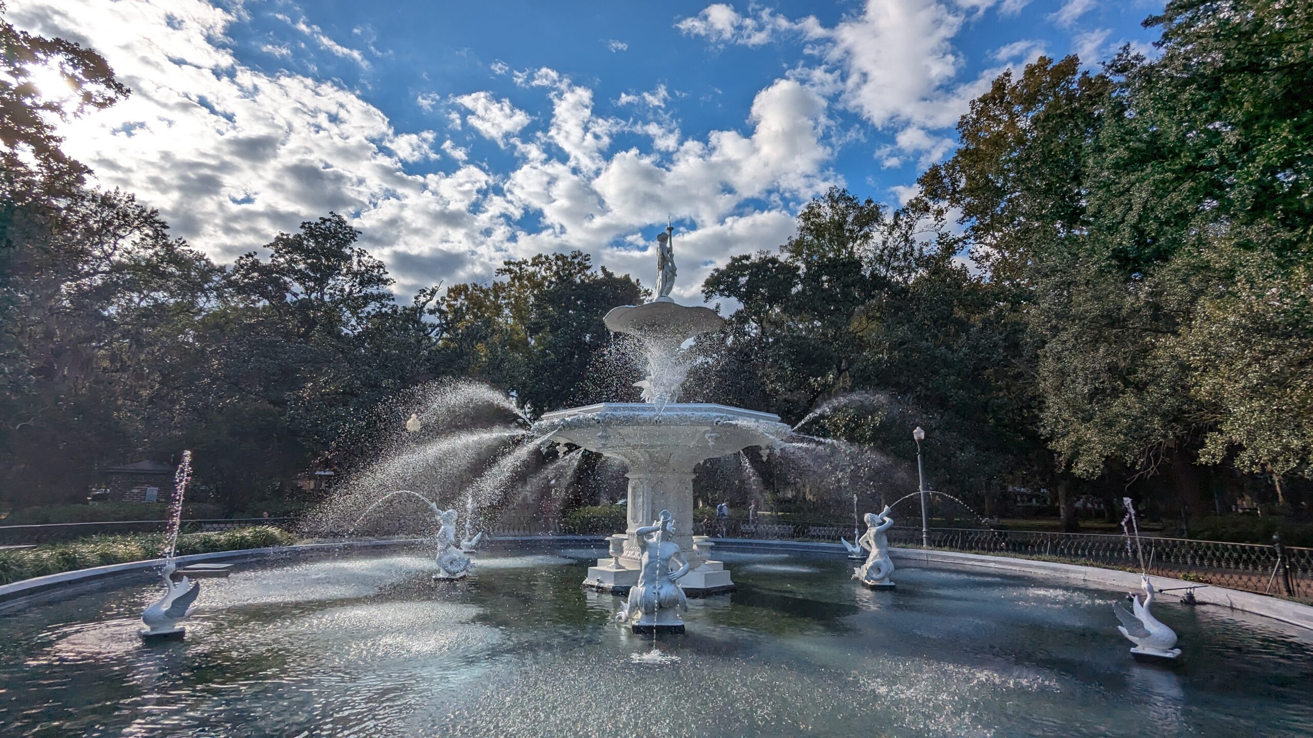 The Forsyth Park fountain in Savannah Georgia — close-up view showing the tiered cast iron sculpture with statues and water jets